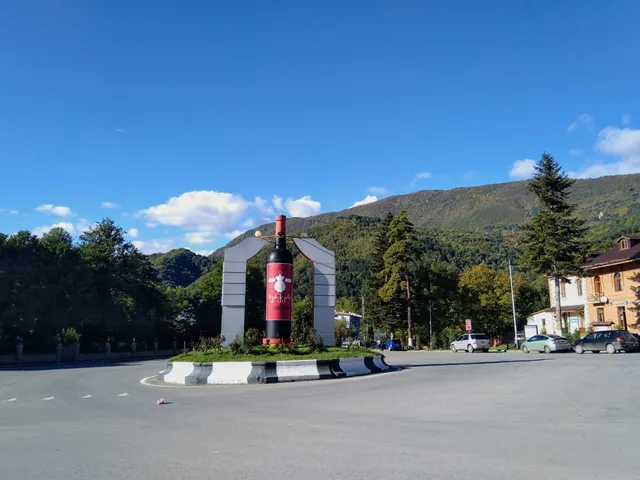 Giant Khvanchkara wine bottle monument at the entrance to Ambrolauri, Georgia