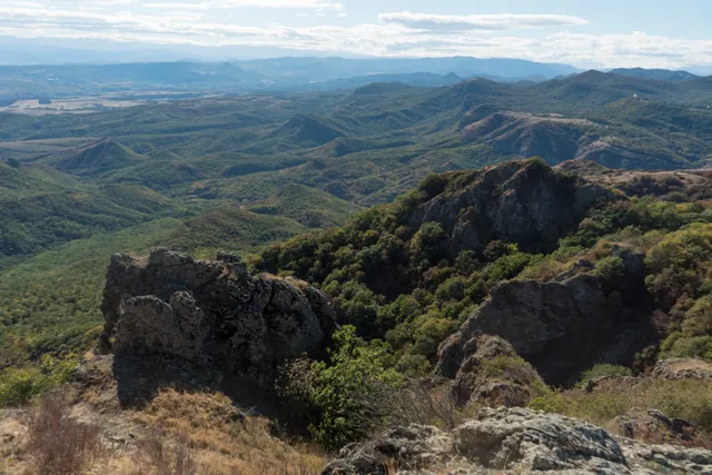 Panoramic view from Azeula Fortress over forested valleys, canyon ridges and distant plains of Kartli