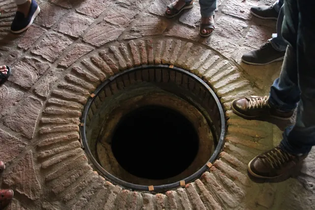 The mouth of a qvevri set into the floor of a marani