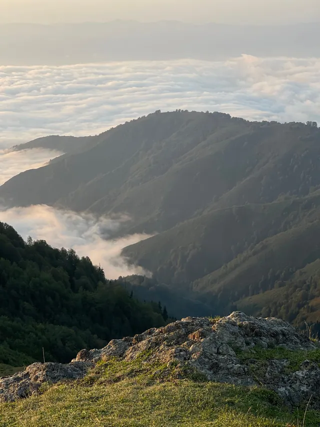 Cloud sea under the ridges of Guria from a rocky crest