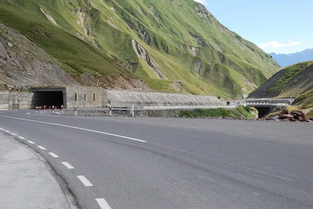 The Georgian Military Highway beside an avalanche gallery in green mountains
