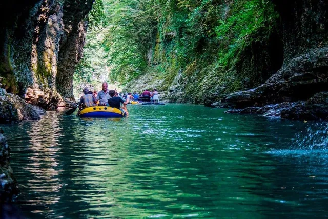 Historical Dadiani steps in Martvili Canyon — mossy limestone and overhanging cliffs