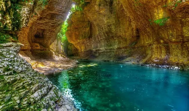 View from the boat of the 12-meter waterfall inside Martvili Canyon