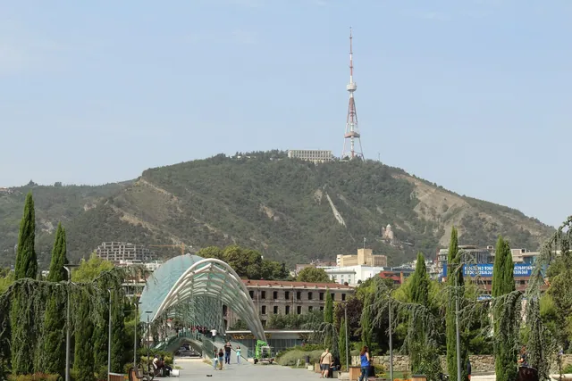 Mtatsminda Mountain with the TV tower and the funicular line above the Bridge of Peace