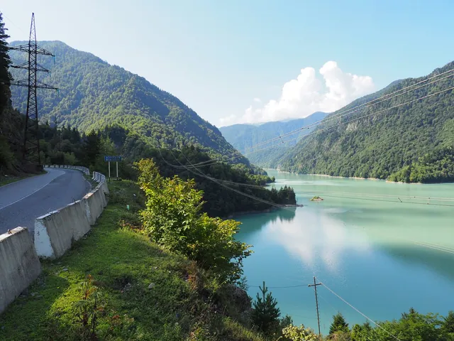 The turquoise Enguri reservoir seen from the road near Barjashi