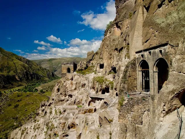 Vardzia Church of the Dormition and bell tower – cave monastery with Georgian mountain landscape